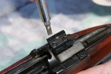 Image result for tightening the screws on a rifle scope