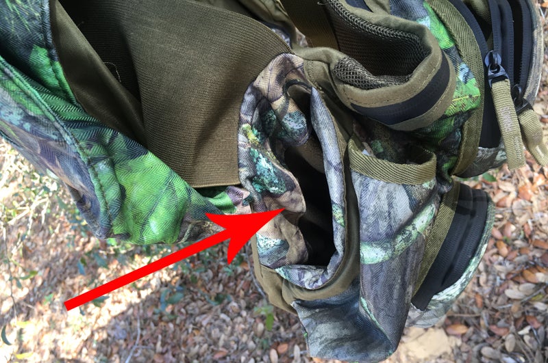 Arrow indicates the right handwarmer pocket. They are deep and fleecy and snug. (Photo © Russ Chastain)