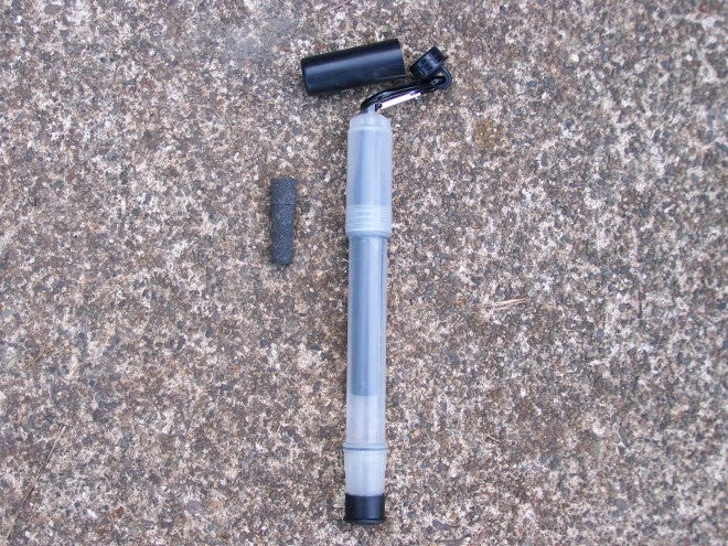 The Clearly Filtered Straw can filter up to 25-gallons of water. That little charcoal gray device is a pre-filter next to the top of the straw -- it helps keep out mud or silt that can cut down on the service life of the unit. The pre-filter is stored in the little black cap attached to the Straw.