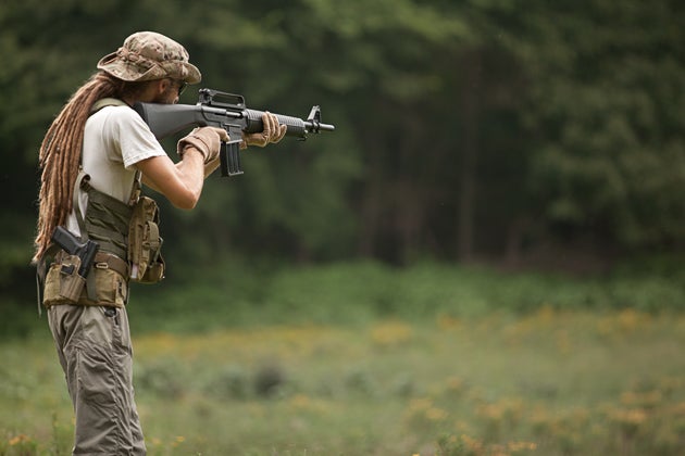 MKA1919 aimed at the target. Magazine pouches made for double-stack 308 magazines fit the single 12ga magazines just fine.