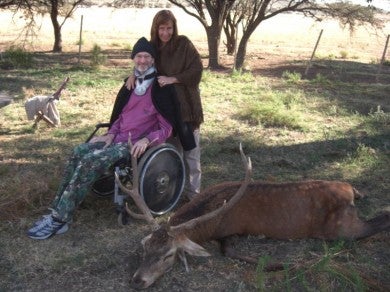 Andy and his wife with a stag taken by moonlight.