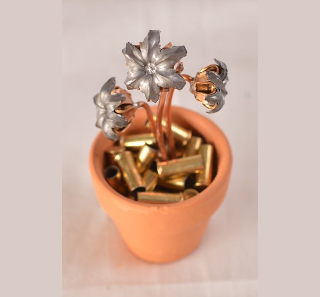 The 3-bloom flower pot - about 4" tall, with a pot 1.75" diameter and 2" high, retails for $24.95. 