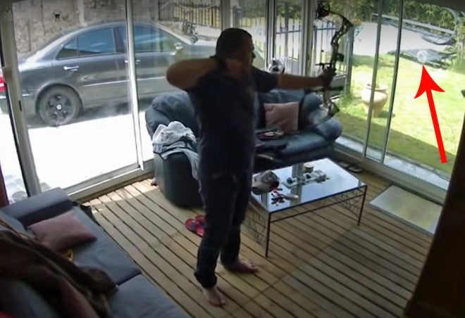 Video: Archer Forgets to Open Glass Door Before Shooting
