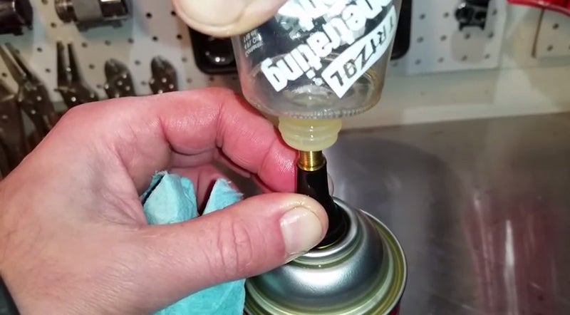 Watch: How to Refill an Aerosol Can With Oil and Pressurize it Watch: How to Refill an Aerosol Can With Oil and Pressurize it