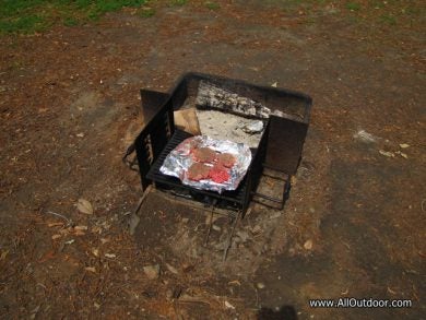 Cooking burgers on a fire ring