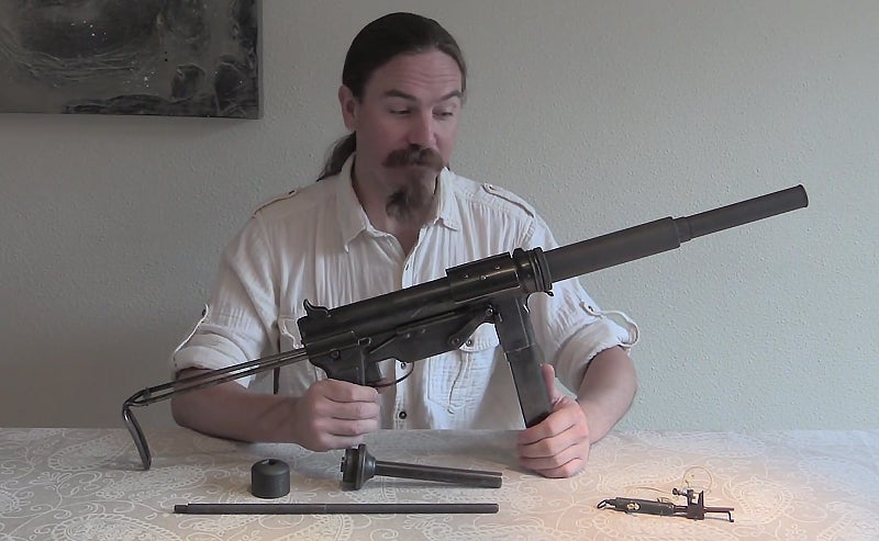 Watch: Suppressed OSS M3 Grease Gun and “Bushmaster” Booby Trap Watch: Suppressed OSS M3 Grease Gun and “Bushmaster” Booby Trap