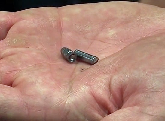 A slug next to a formed bullet. 
