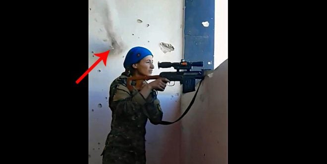 Watch: Female Sniper Almost Hit by ISIS