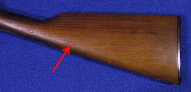 Arrow indicates a crack in the butt stock. (Photo © Russ Chastain) 