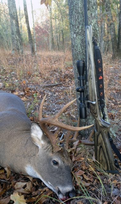 A few hours into this rifle's first deer hunt, one shot dropped this fine buck in its tracks. (Photo © Russ Chastain) 