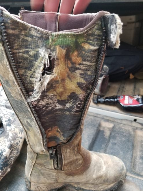 The hole torn into his boot by a tree step. (Image: Dwight Jones)