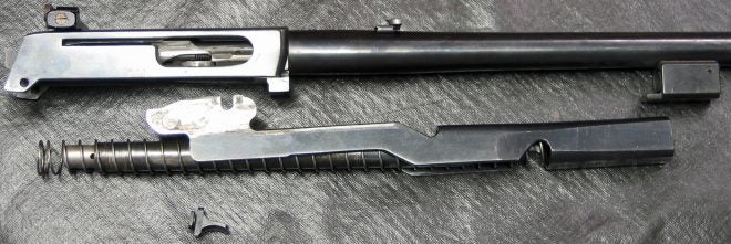 After separating Ruger 44 carbine magazine, recoil spring, and slide assembly. (Photo © Russ Chastain) 