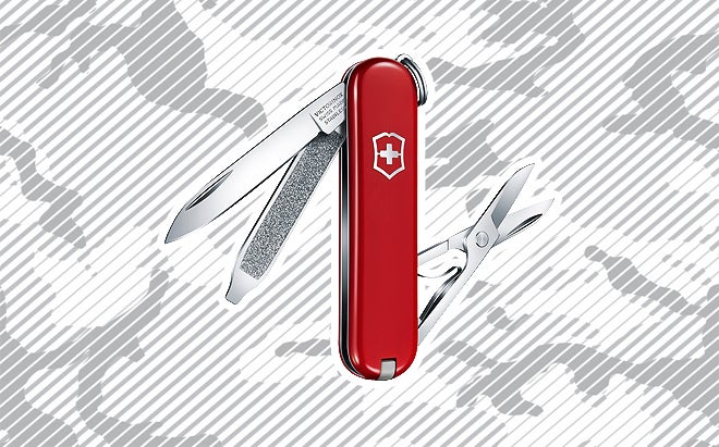 Victorinox Classic SD pocket knife on urban camo background