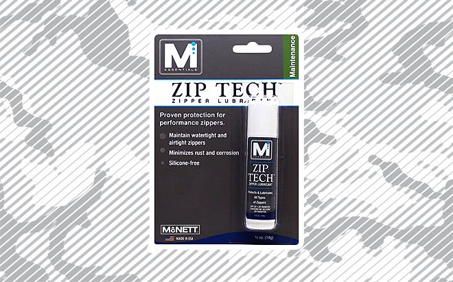 McNett Zip Tech zipper lubricant on urban camo background