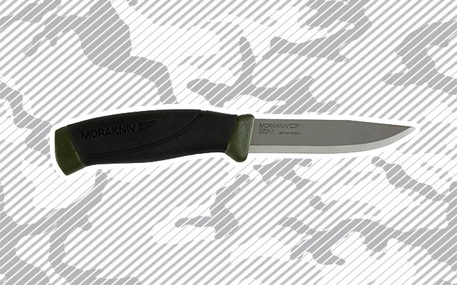 Morakniv MG Companion carbon steel fixed-blade outdoor knife on urban camo background