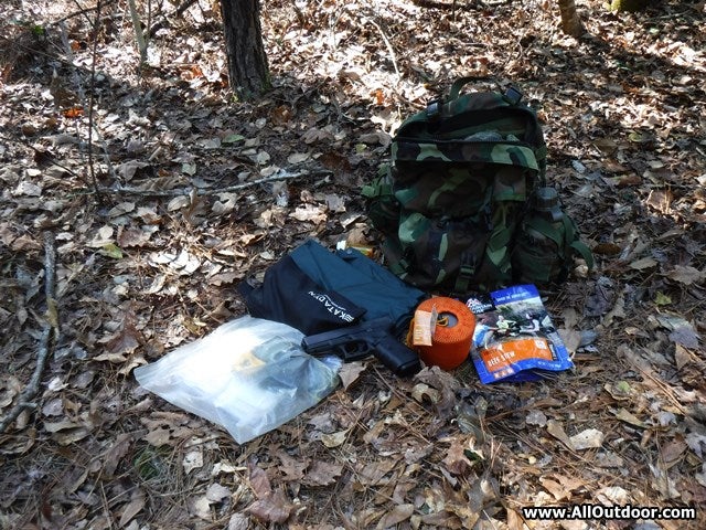 Glock next to backpack