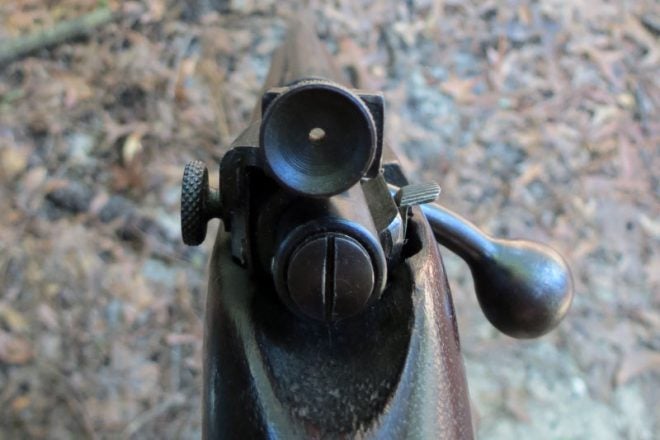 The peep sight on an old 22 rifle. The large surface area helps keep your eye focused on the front sight. Photo © Russ Chastain