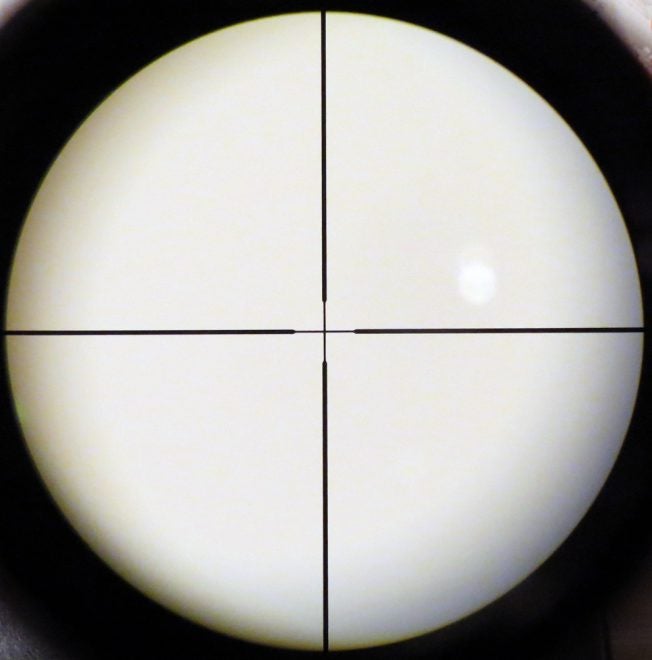 A simple duplex crosshair reticle in a conventional scope. Aiming point is right in the center. Photo © Russ Chastain