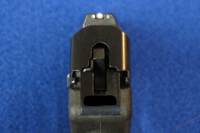 This pistol has three-dot sights, almost properly aligned (front sight is a bit too far left). The front sight's white dot is not as large as it appears here. Usually, the bullet should strike at the top edge of the front sight. Photo © Russ Chastain