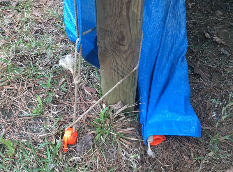 Orange Screw ground anchor in use.