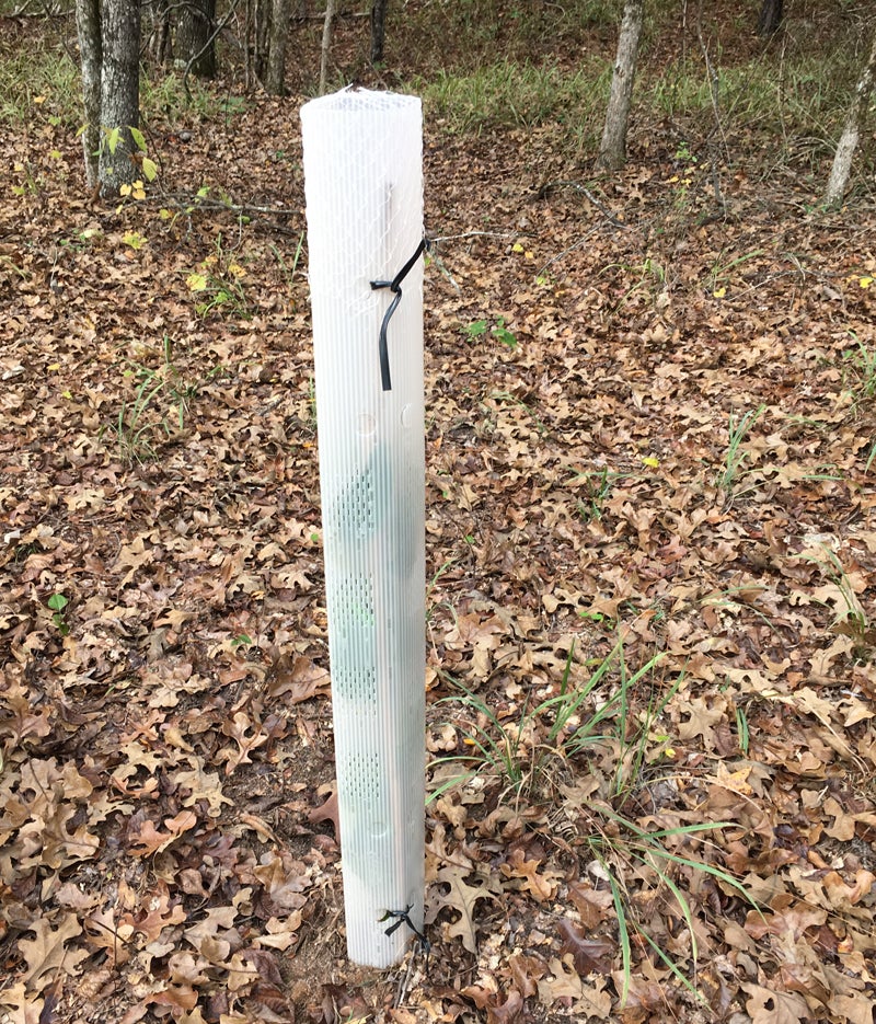 Grow tube is attached to the stake inside using double-wire twisters.