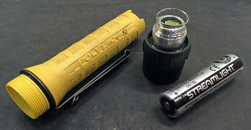 Polytac X USB flashlight with 18650 USB battery and head removed.