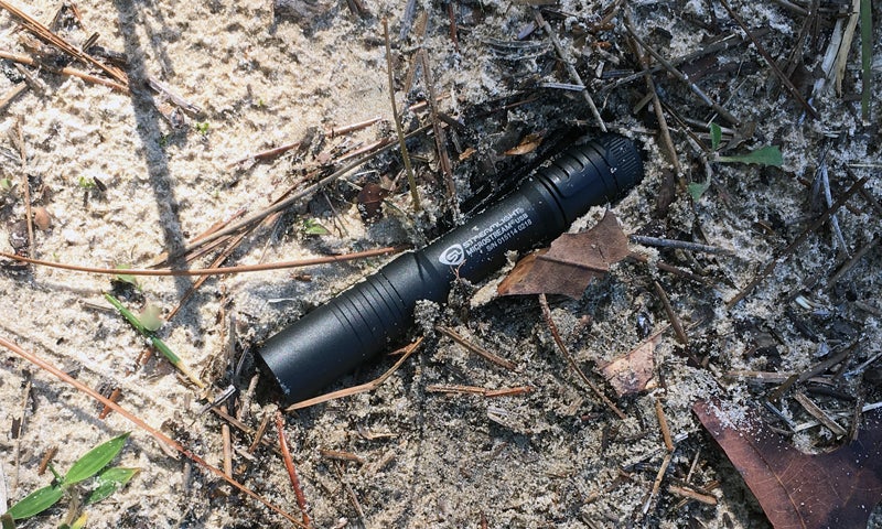 Streamlight MicroStream USB pocket flashlight where I found it in the dirt.