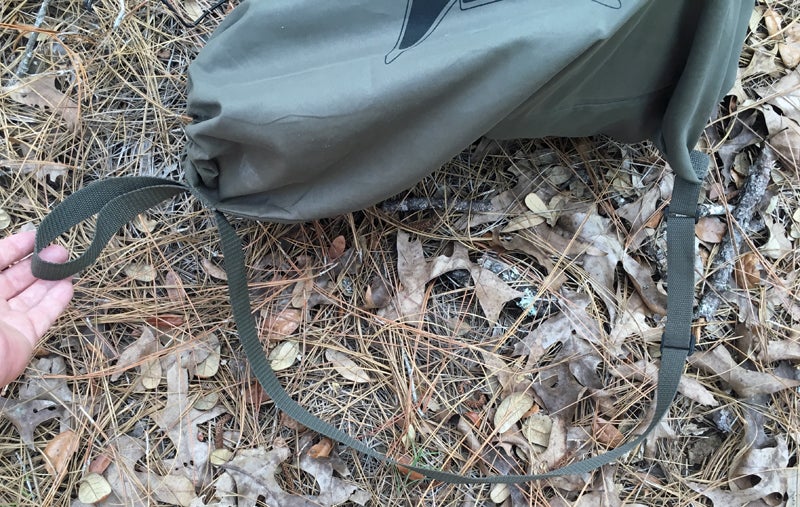 The shoulder strap is adjustable and the small loop helps when stowing the decoy.