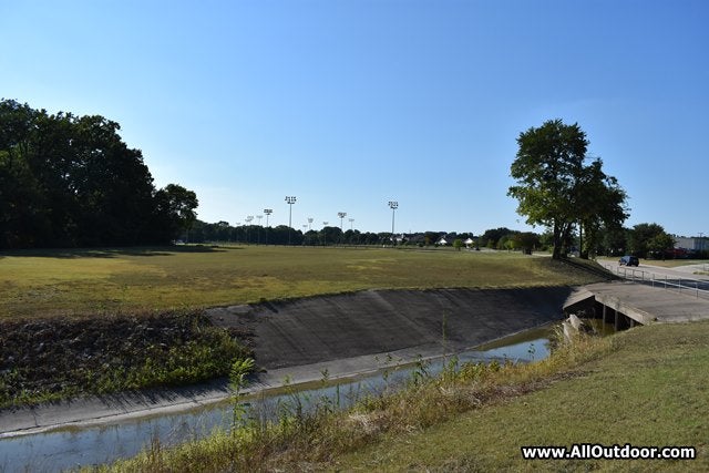 Sports field next to a creek