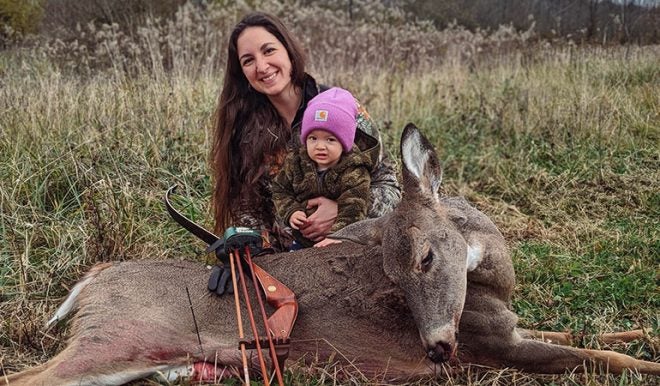 Young Mom Arrows Doe With Her Baby Daughter on Her Back