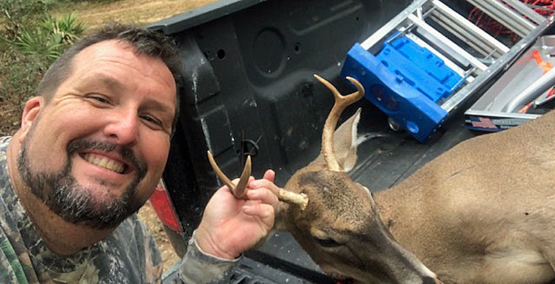 Shane with a fine Florida public-land buck. (Photo © Russ Chastain)