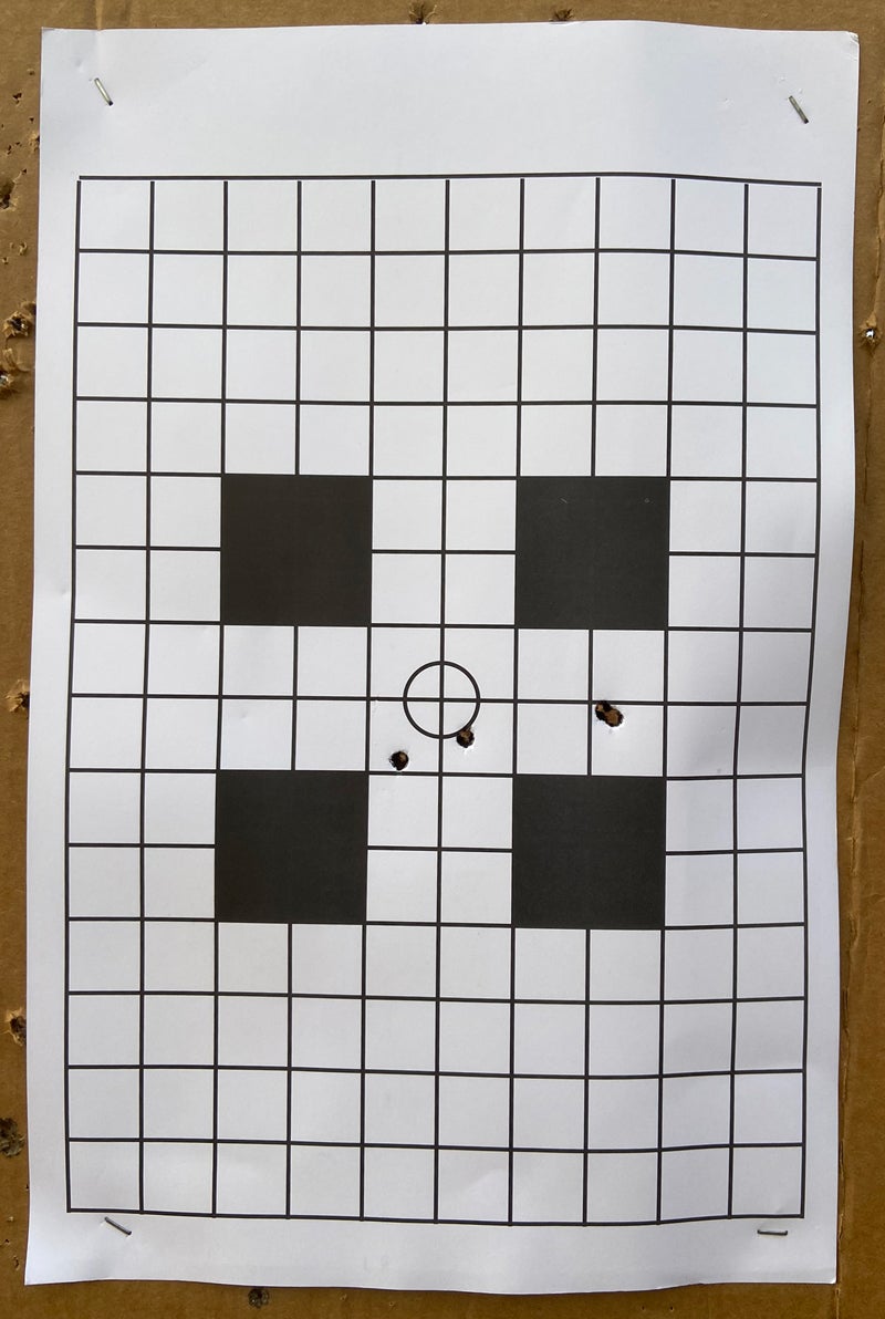 The 200-yard target. Oblong hole at right indicates the first group. (Photo © Russ Chastain)