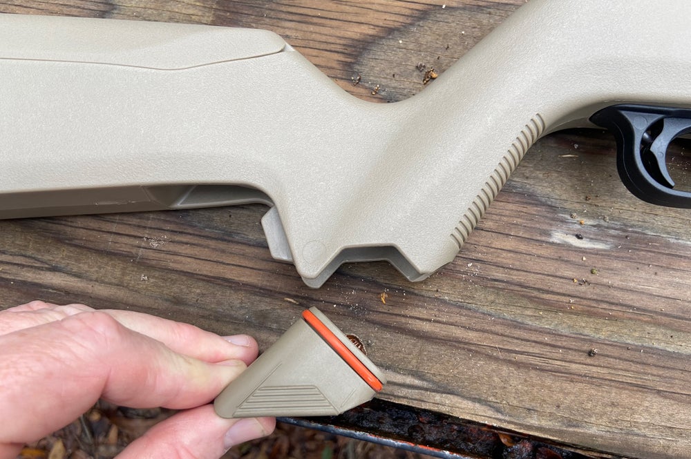 Depress a release and you can pull out the cap (Magpul calls it a "grip core"). It has an O-ring seal for water resistance. (Photo © Russ Chastain)