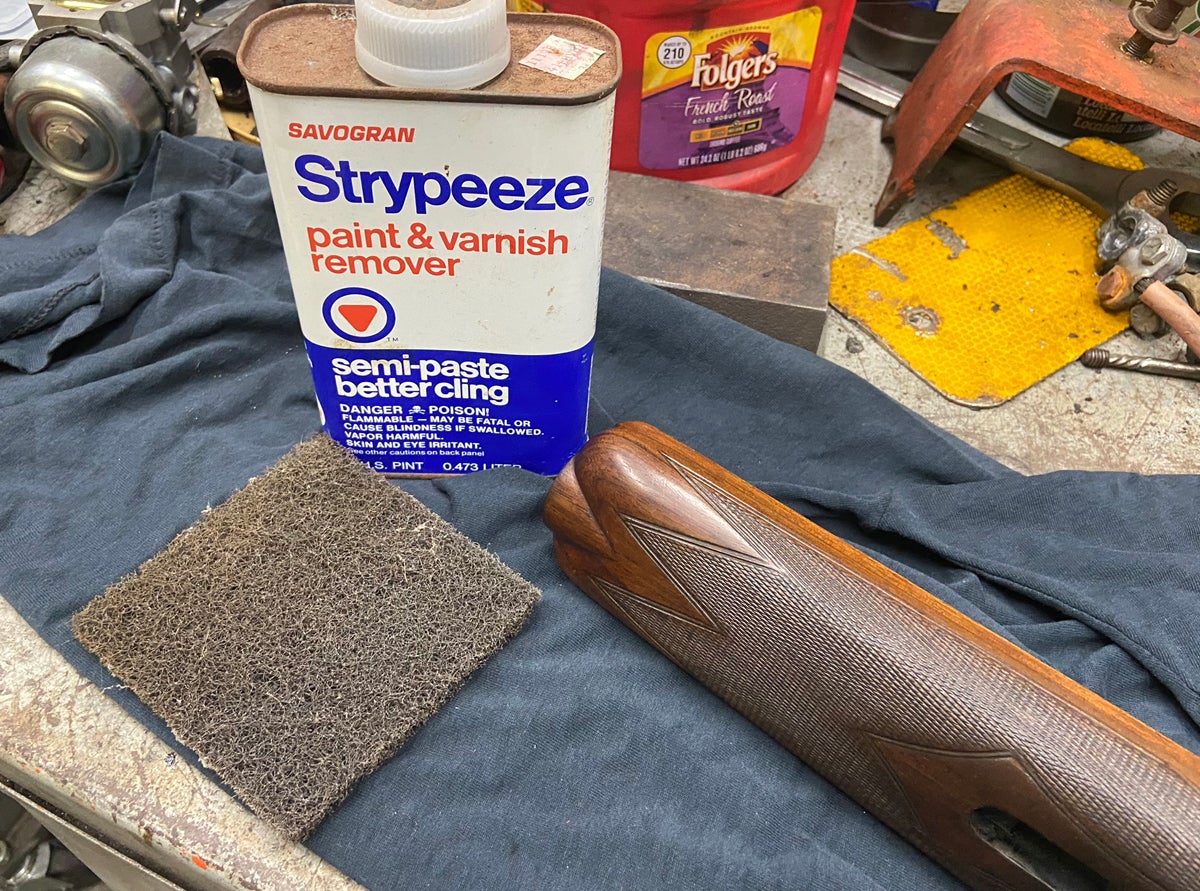 Never sand the finish off of a gun stock. Always strip the old finish instead. The less wood you remove, the better. (Photo © Russ Chastain)