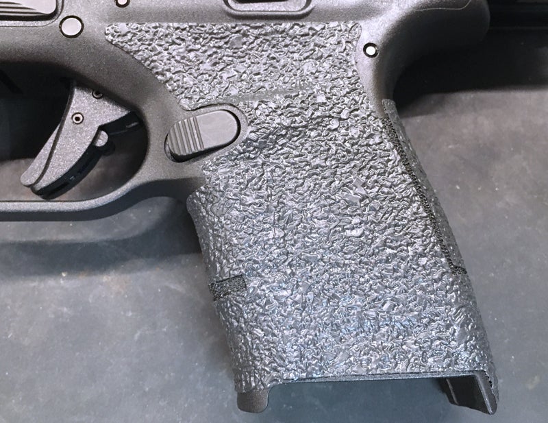 Freshly-installed Talon Grip on a Hellcat pistol. (Photo © Russ Chastain)