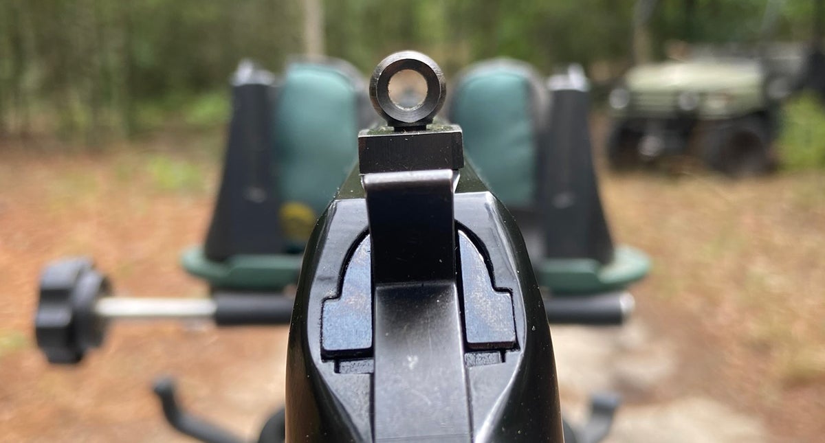 Without the screw-in aperture (which I have managed to misplace), the larger peep hole allows the shooter to see more of the target. (Photo © Russ Chastain)