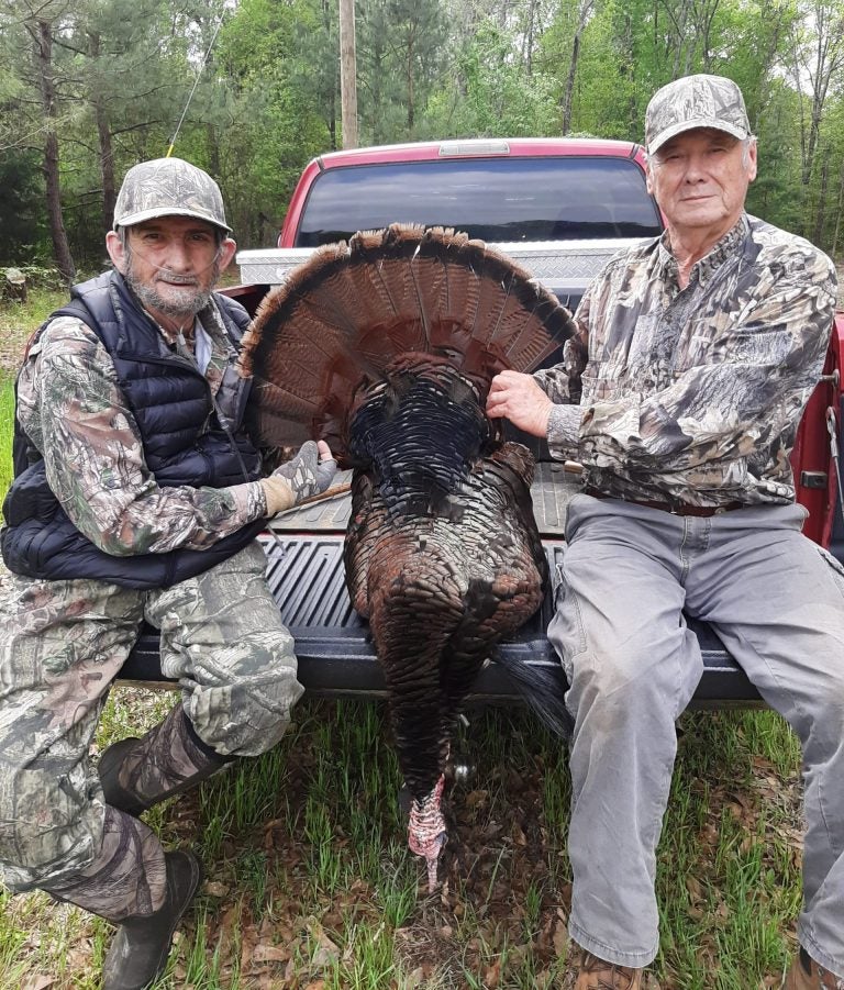 Raymond Gibbs with his first wild turkey and his guide Ken Pittman.