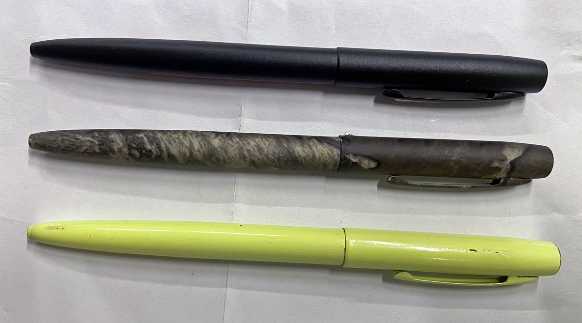 Cap-O-Matic Space Pens in Firefighter (top), TrueTimber, and Tradesman Yellow (bottom). (Photo © Russ Chastain)