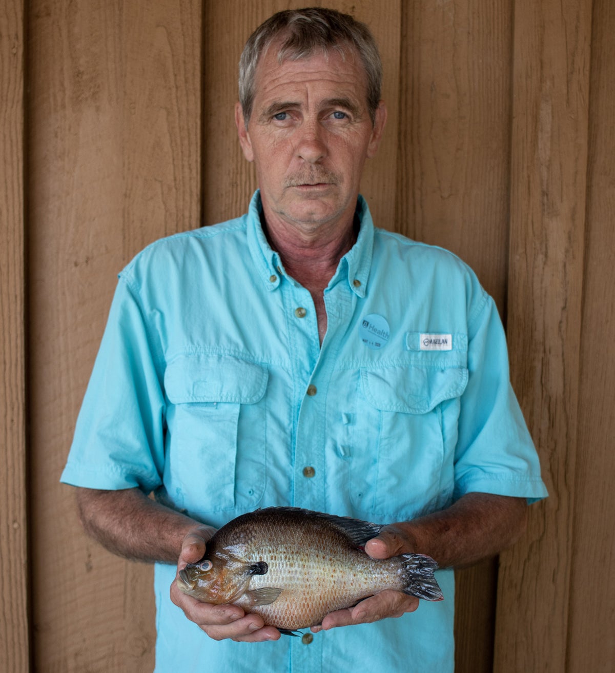 Danny Vann with his record-setting redbreast. Doesn't look very happy, does he?