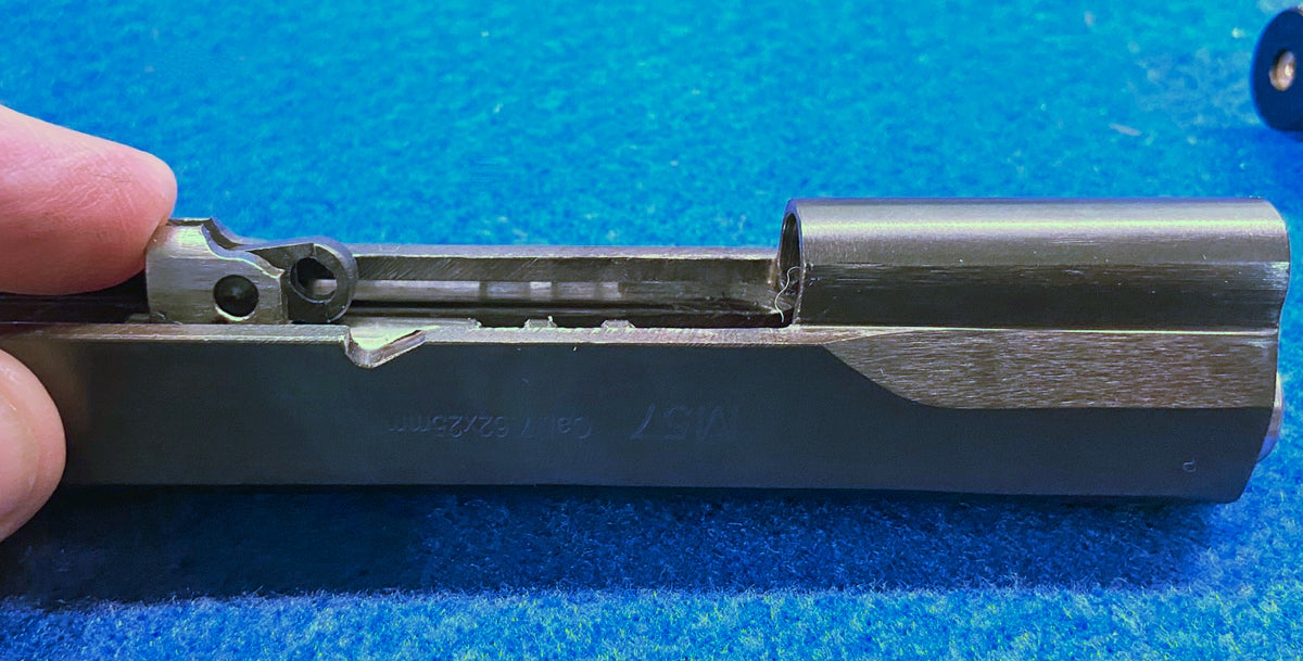 The barrel link needs to be hinged forward against the barrel. (Photo © Russ Chastain)