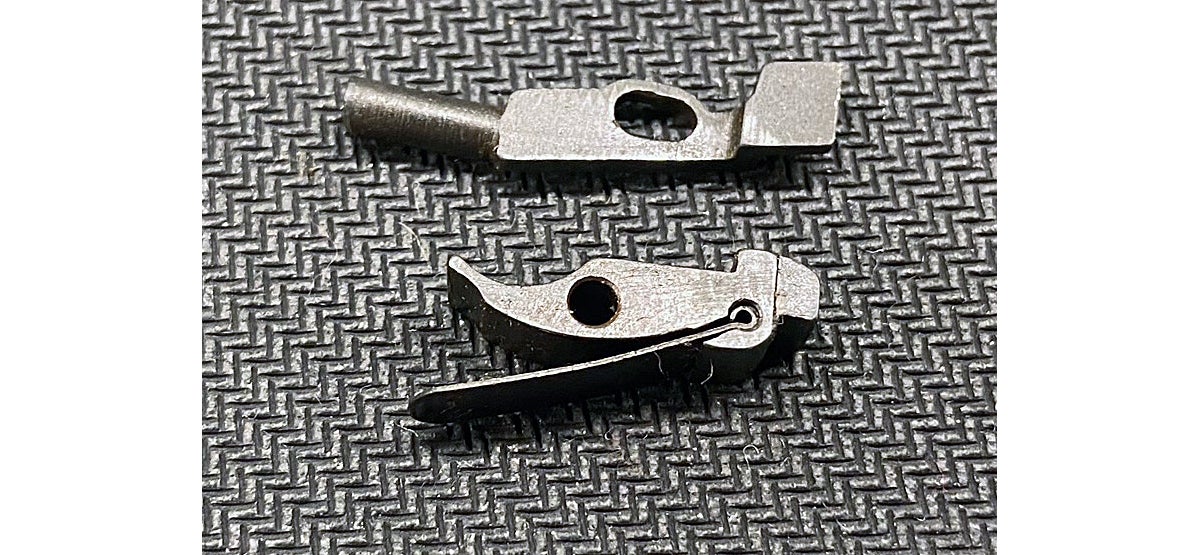 M57 Tokarev sear (bottom) and disconnector (top). (Photo © Russ Chastain)