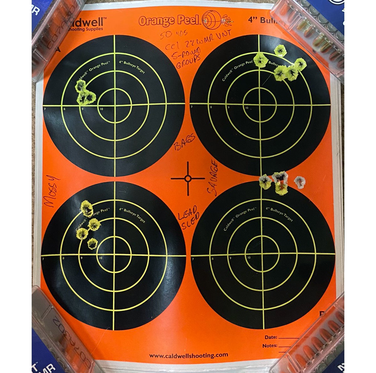 I fired the two 50-yard groups on the left with the Mossberg; right with Savage. The top groups were fired from bags while the bottoms were fired from a Lead Sled DFT. (Photo © Russ Chastain)