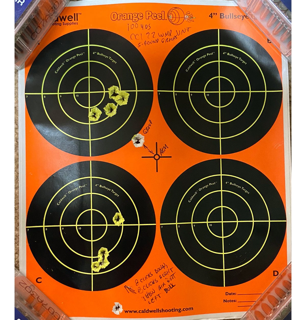 I fired these two 100-yard groups using the Mossberg. I aimed at center of target for the top group, then adjusted the scope and aimed at the bottom left bull. (Photo © Russ Chastain)