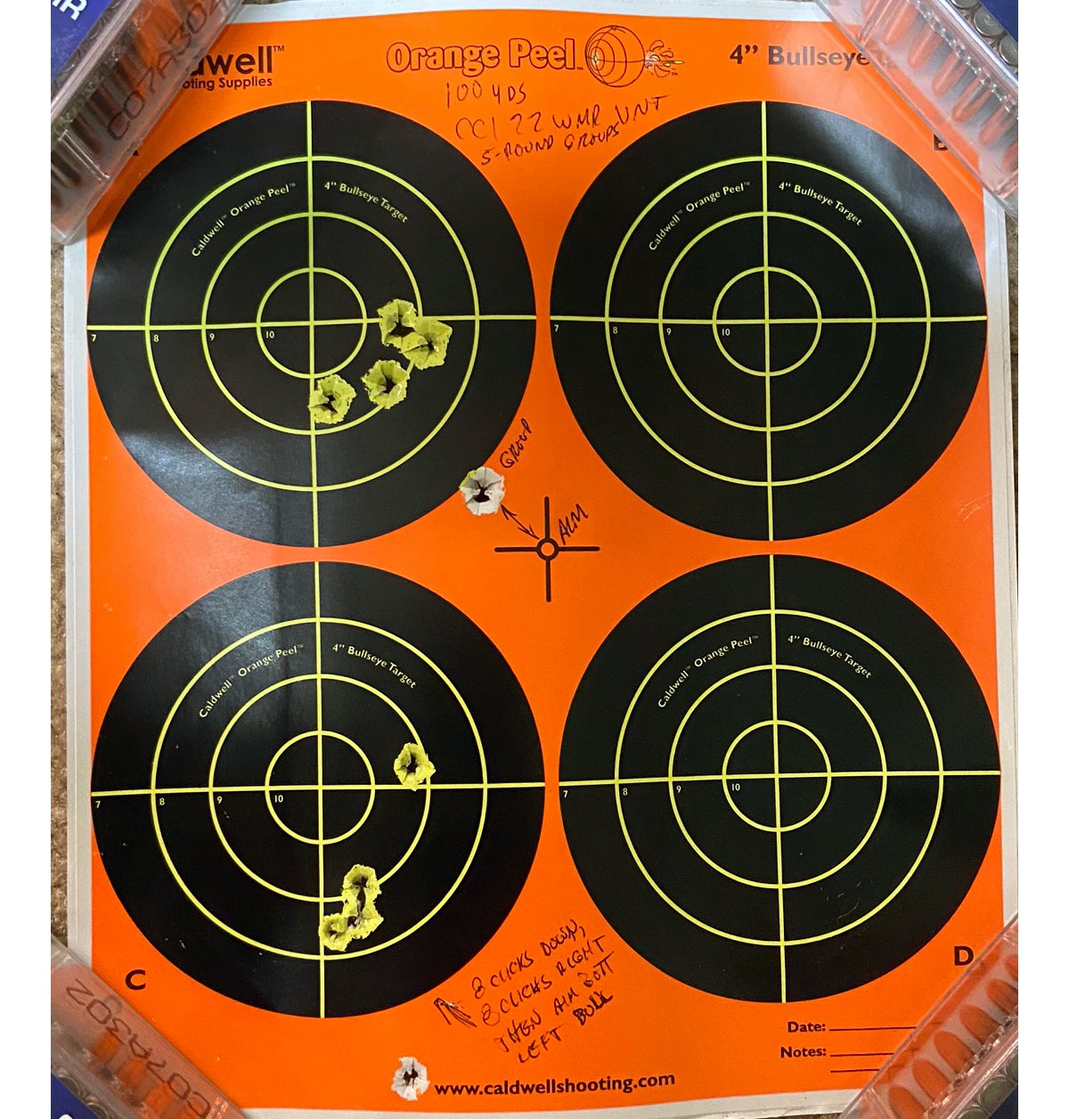 I fired these two 100-yard groups using the Mossberg. I aimed at center of target for the top group, then adjusted the scope and aimed at the bottom left bull. (Photo © Russ Chastain)