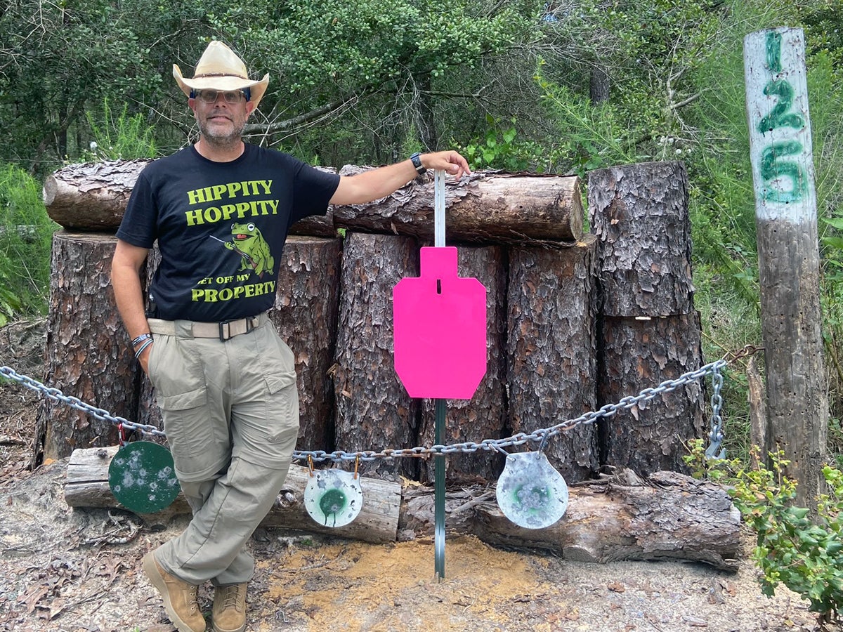 Hank and his new steel target. (Photo © Russ Chastain)