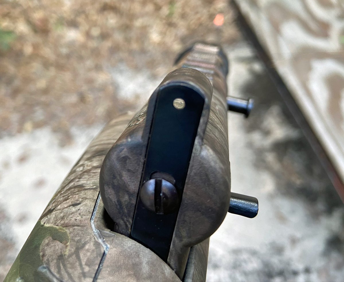 The rear sight is a simple steel strip with a hole at either end. (Photo © Russ Chastain)