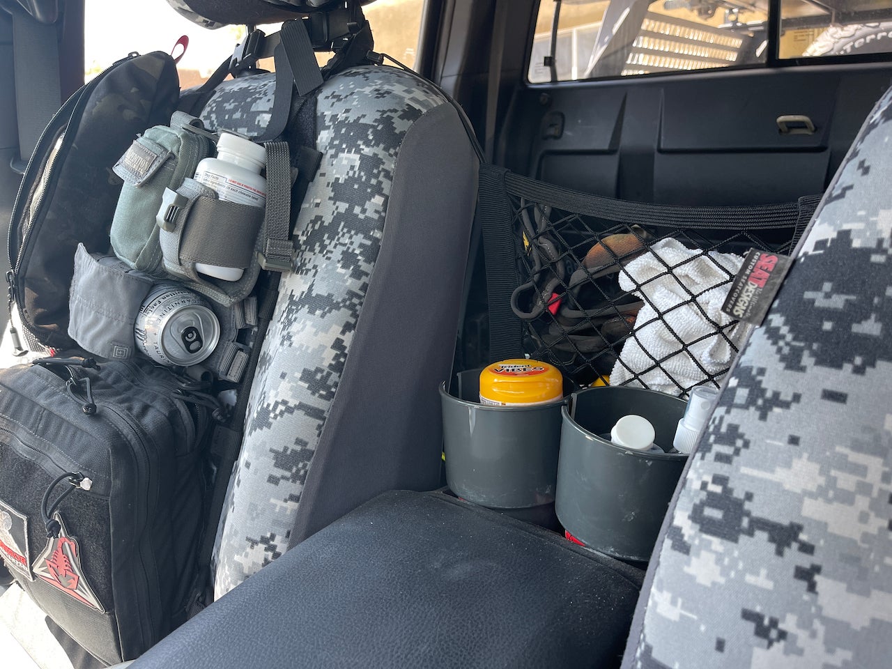 seat organization panel and mesh between the seat organizer