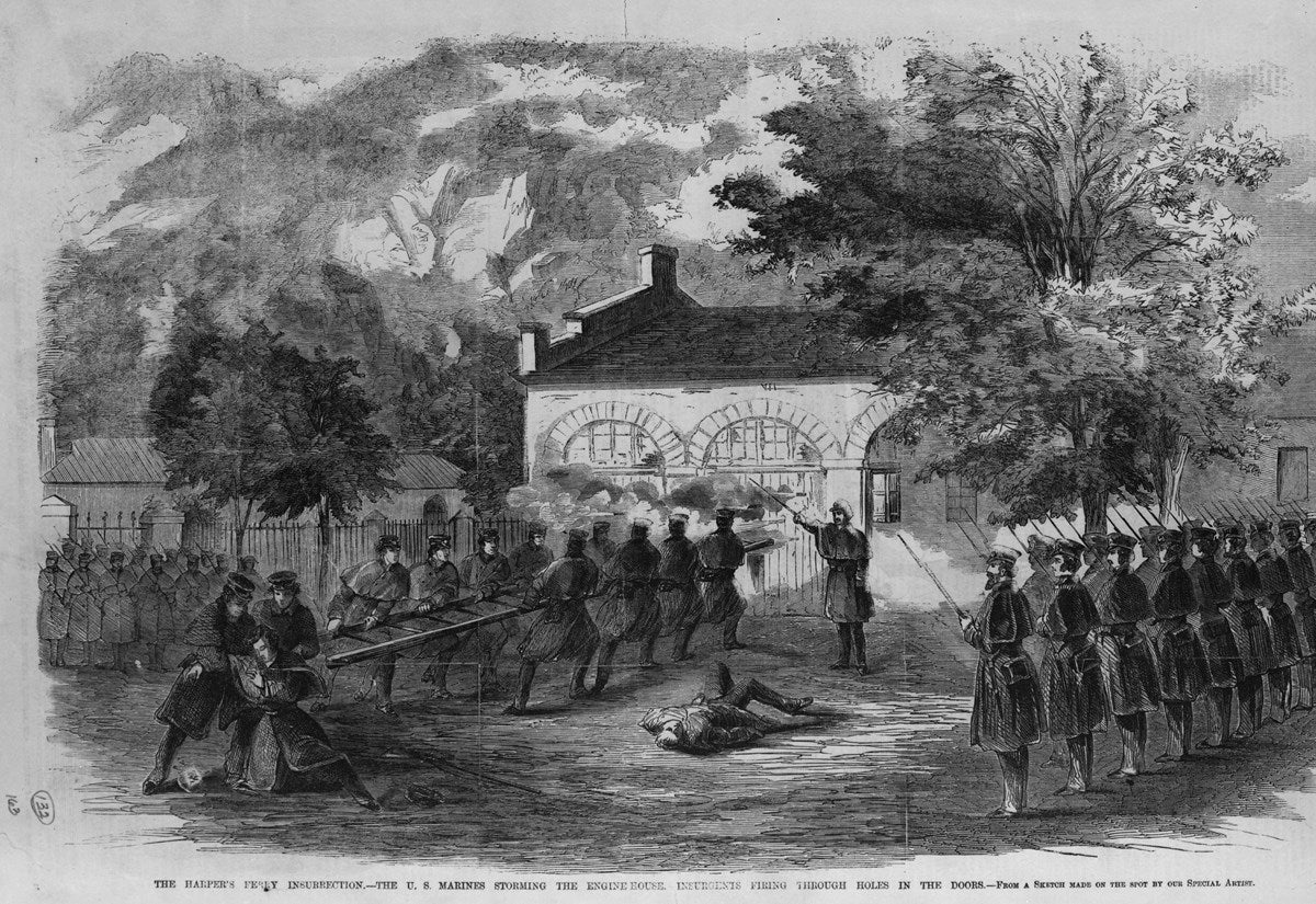 The Harper's Ferry Riot - The US Marines storm the engine house - Insurgents fire through holes in the doors / from a sketch made by our special artist on site.